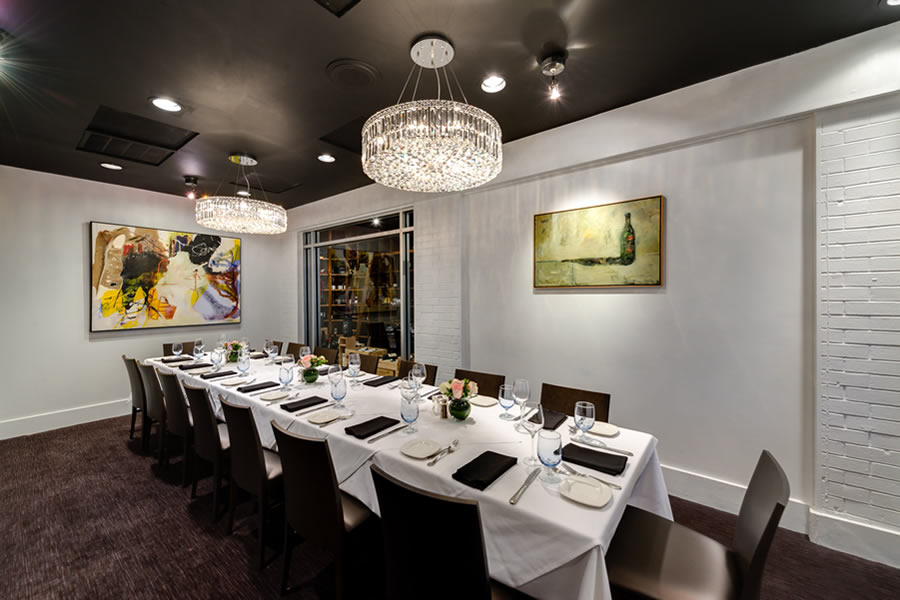 Image of the Amerigo's Grille Wine Room set for a private dining event.