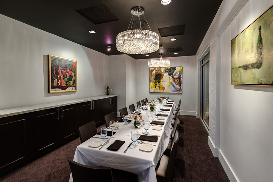 Image of the Amerigo's Grille Wine Room set for a private dining event.